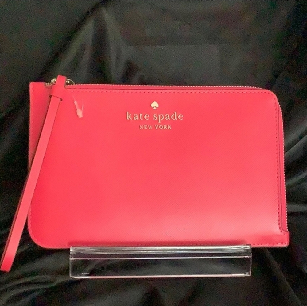 New Kate Spade without the tag. Pink wristlet.